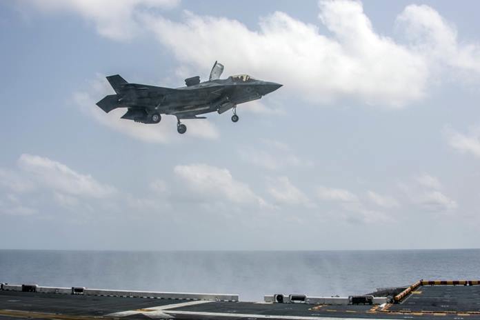 An F-35B Lightning II fighter aircraft assigned to the 31st Marine Expeditionary Unit (MEU), Marine Medium Tiltrotor Squadron (VMM) 265 (Reinforced), lands on the flight deck of amphibious assault ship USS America (LHA 6) in support of Exercise Cobra Gold 20, March 5, 2020. (U.S. Navy photo by Mass Communication Specialist Seaman Jonathan Berlier)