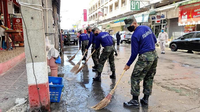 The volunteers rode hosed down streets in Sattahip communities.