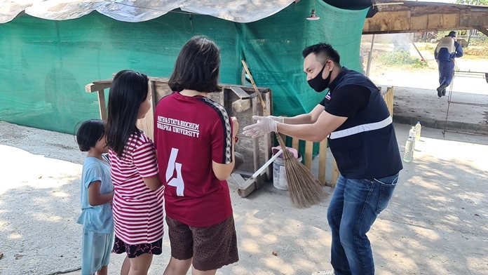 Dr. Satira Puakpraphan speaks to children in the village and instructs them to wash their hands often.