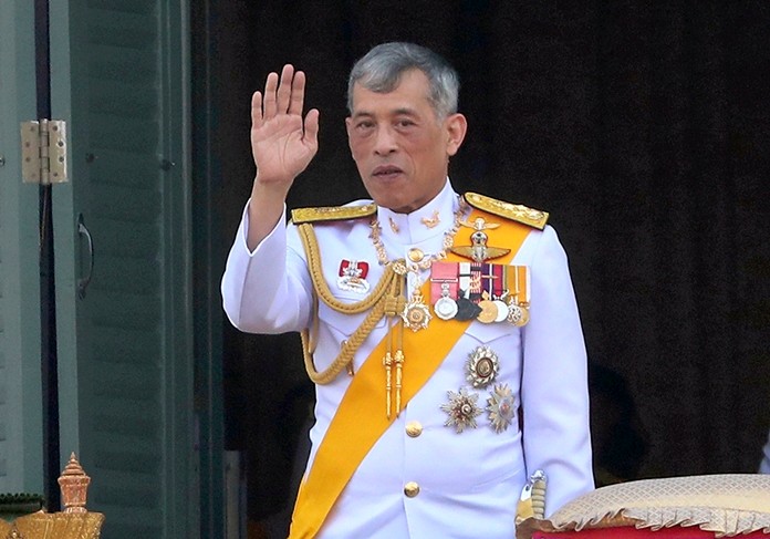 King Maha Vajiralongkorn Bodindradebayavarangkun greets an audience from the balcony of Suddhaisavarya Prasad Hall in the Grand Palace Monday, May 6, 2019, in Bangkok.