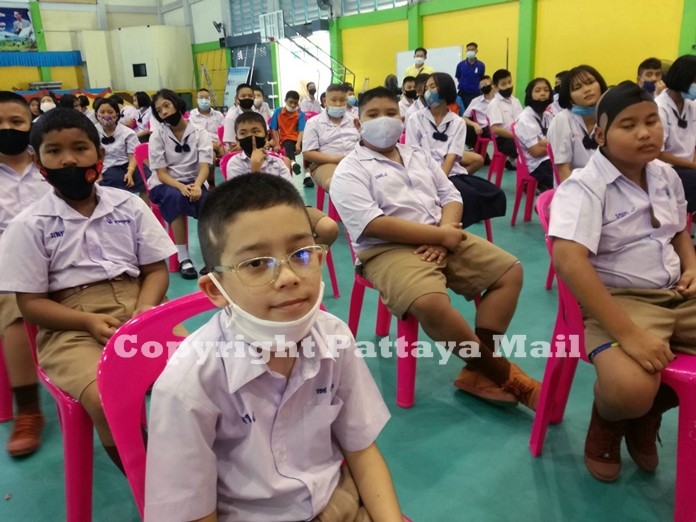 A student looks thoroughly please with his new eye glasses.