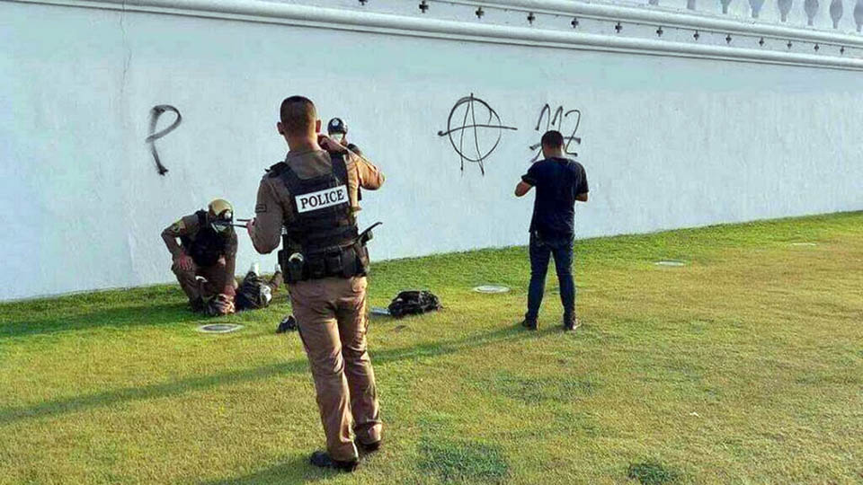 Thai man sentenced to 8 months in prison for spray-painting anti-112 graffiti on Emerald Buddha Temple wall in Bangkok